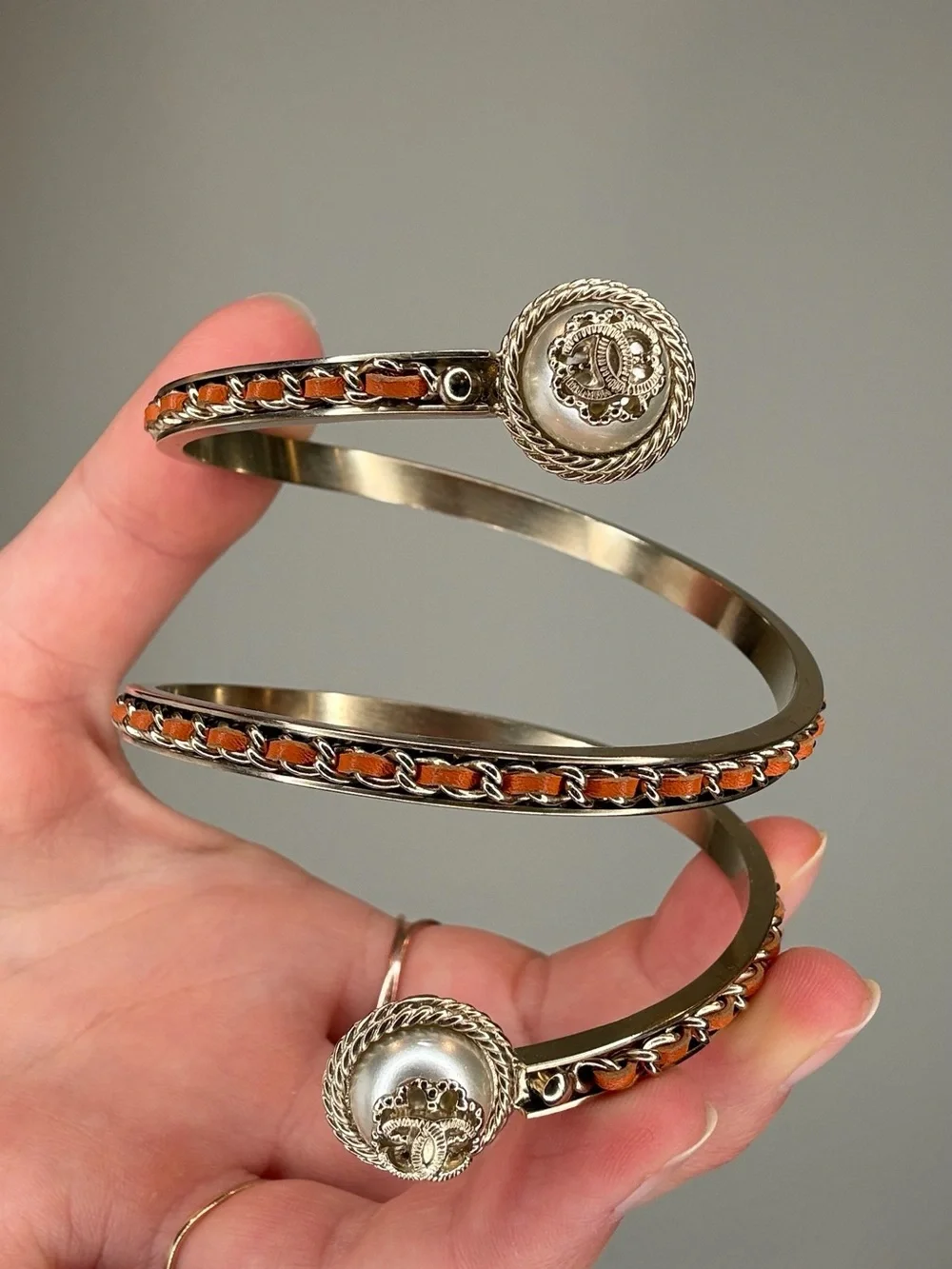 CHANEL Cruise 2018 Gold-Tone Spiral Cuff Bracelet with Orange Leather Accents